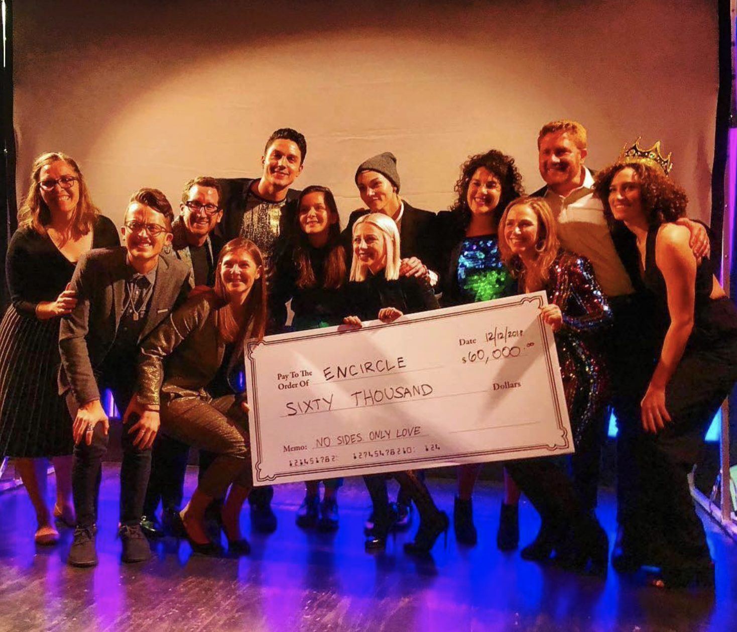 The New York crew holds up the Encircle check