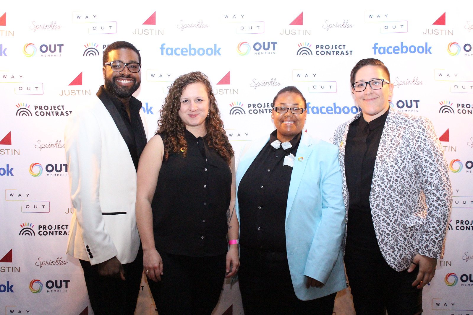 Guests on the sponsor wall at the 2019 LA Gayla, with Facebook, Justin, Sprinkles, Project Contrast and OUTMemphis behind them